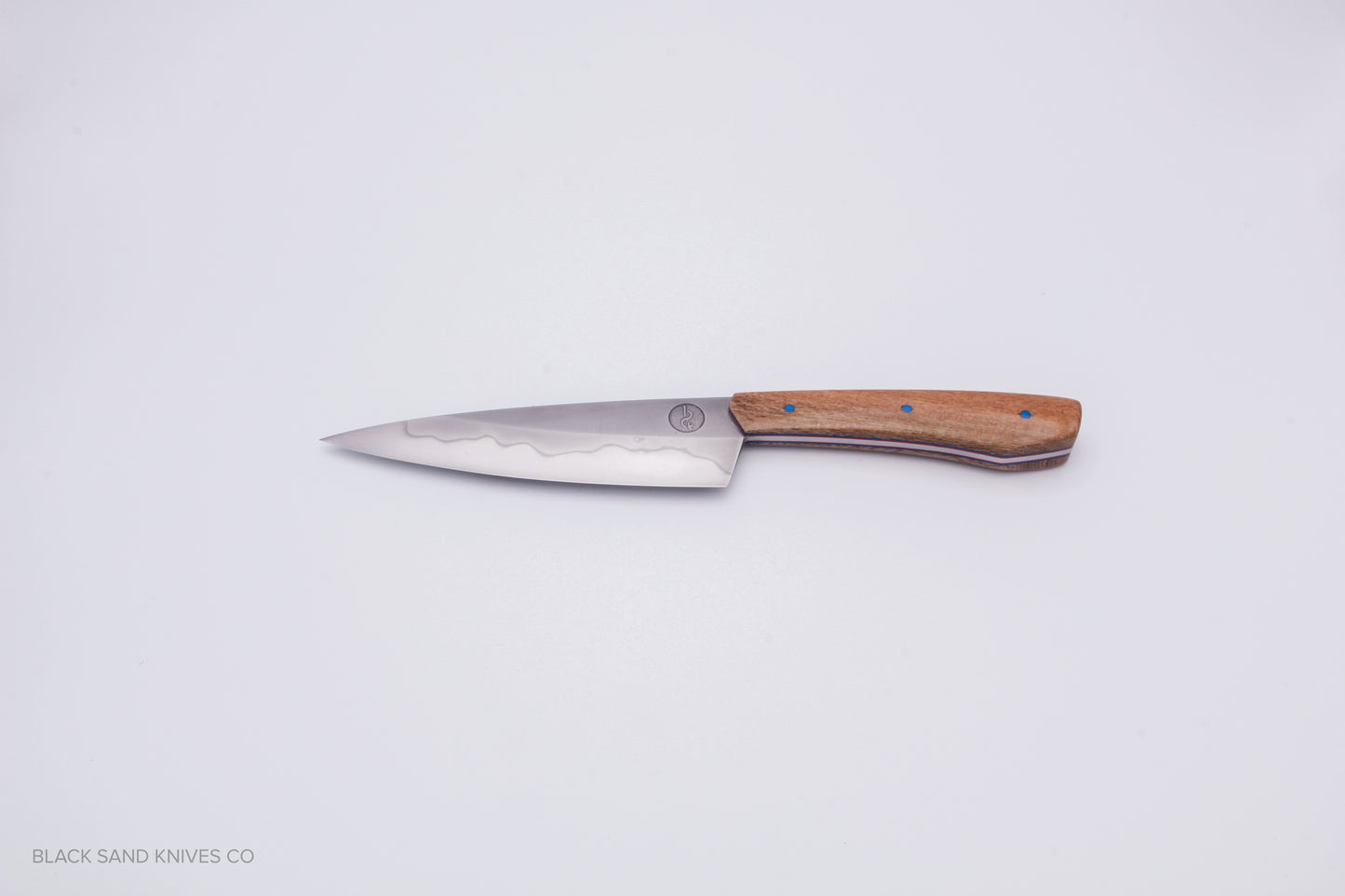 5.5" (140mm) Petty with Hamon in W2 High Carbon Steel with Macadamia Wood Handles - Blue and red liners