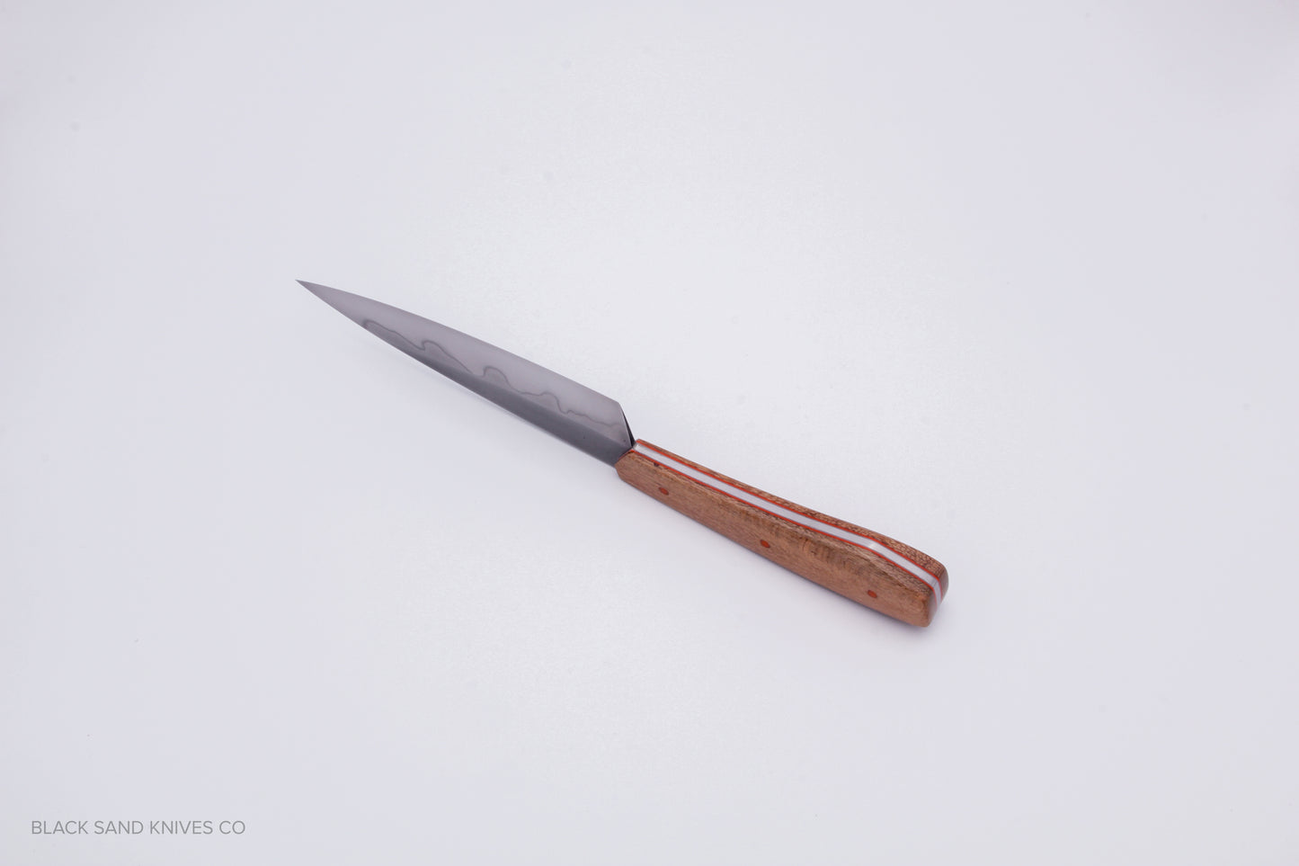 5.5" (140mm) Petty with Hamon in W2 High Carbon Steel with Macadamia Wood Handles in Red & Gray G10 Liners