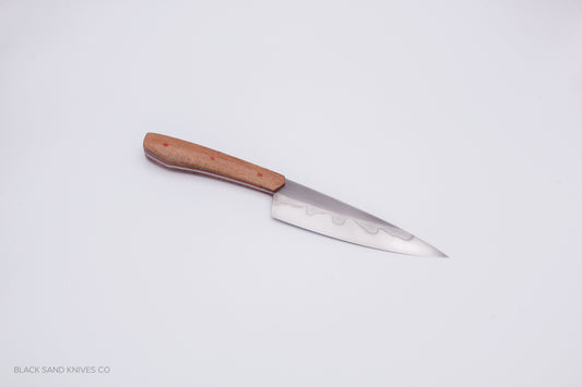 5.5" (140mm) Petty with Hamon in W2 High Carbon Steel with Macadamia Wood Handles in Red & Gray G10 Liners