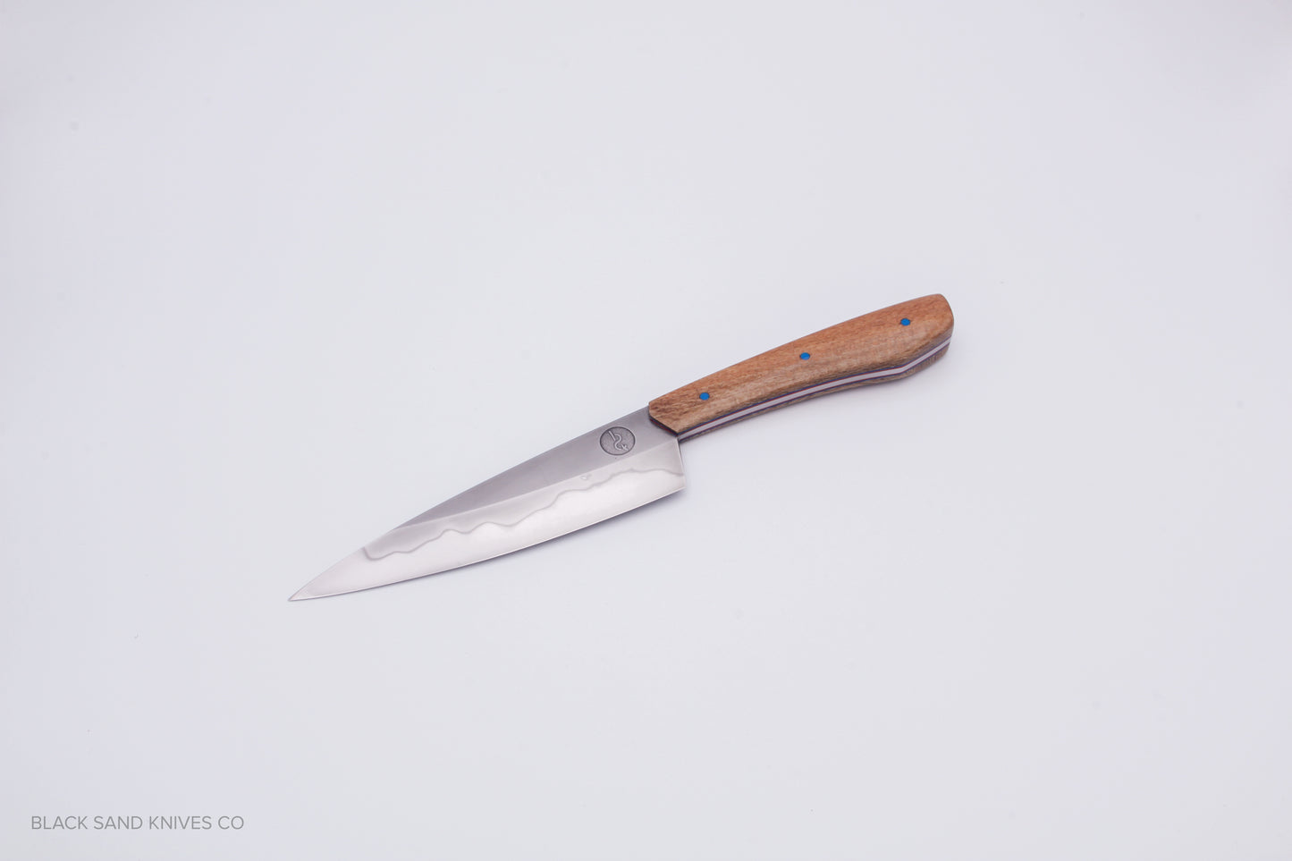 5.5" (140mm) Petty with Hamon in W2 High Carbon Steel with Macadamia Wood Handles - Blue and red liners