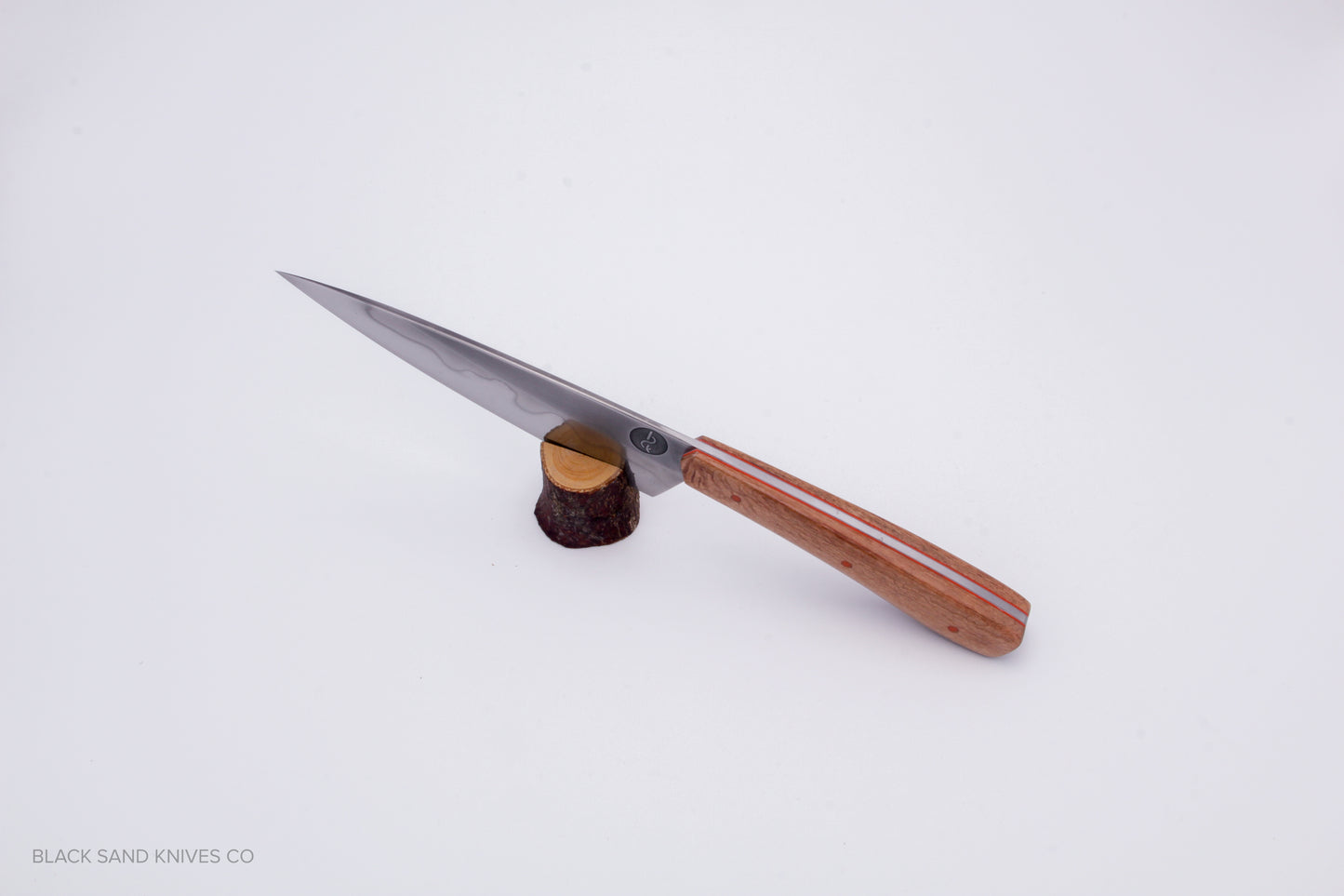 5.5" (140mm) Petty with Hamon in W2 High Carbon Steel with Macadamia Wood Handles in Red & Gray G10 Liners