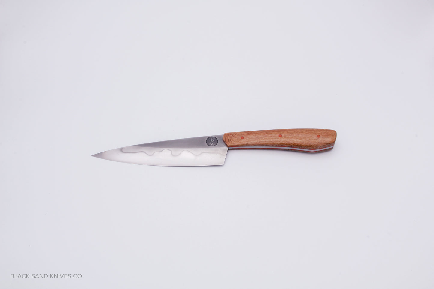 5.5" (140mm) Petty with Hamon in W2 High Carbon Steel with Macadamia Wood Handles in Red & Gray G10 Liners